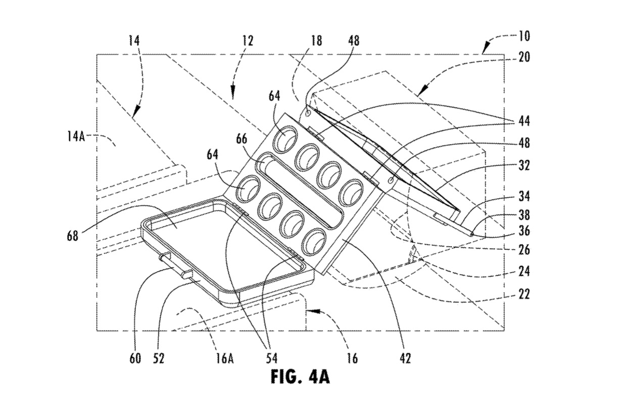 Ford designs a passenger-mounted folding tray storage system